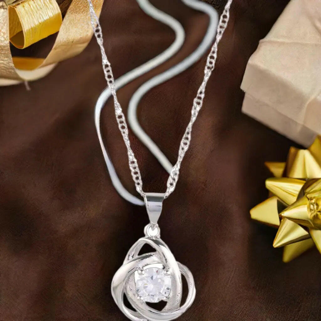 Round Knot Pendant Necklace with Cubic Zirconia.